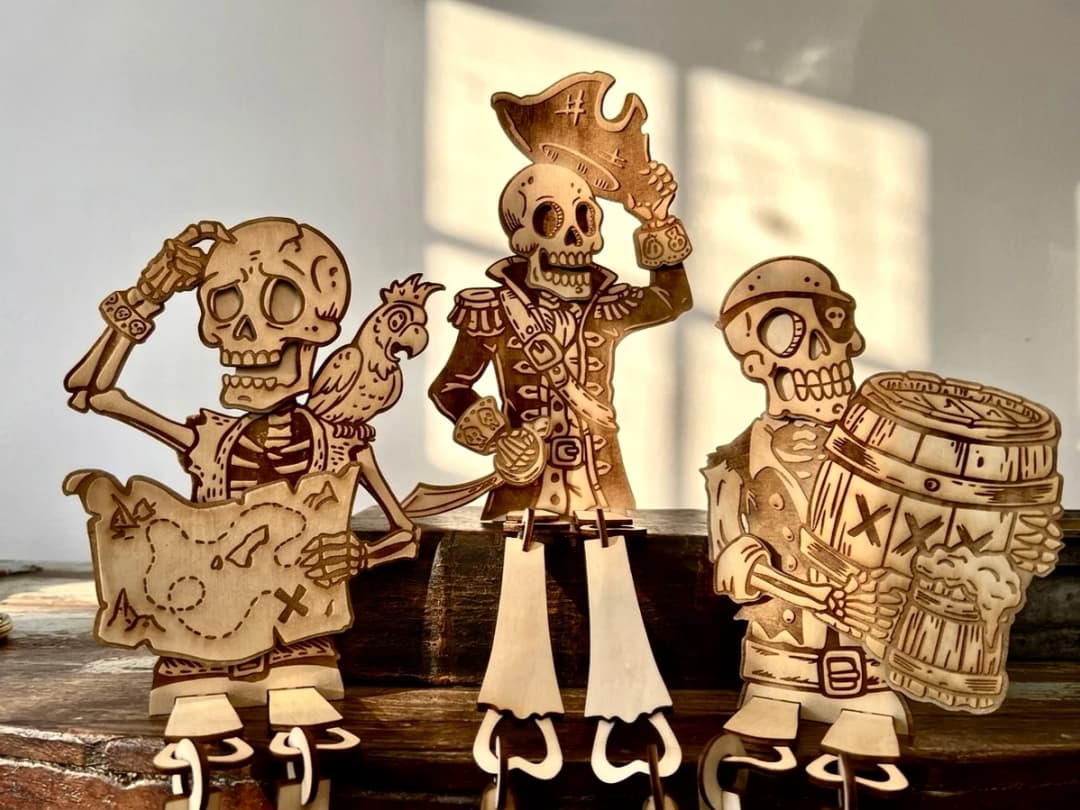 Set of Three Wooden Pirate Skeleton Figurines with Map and Barrel