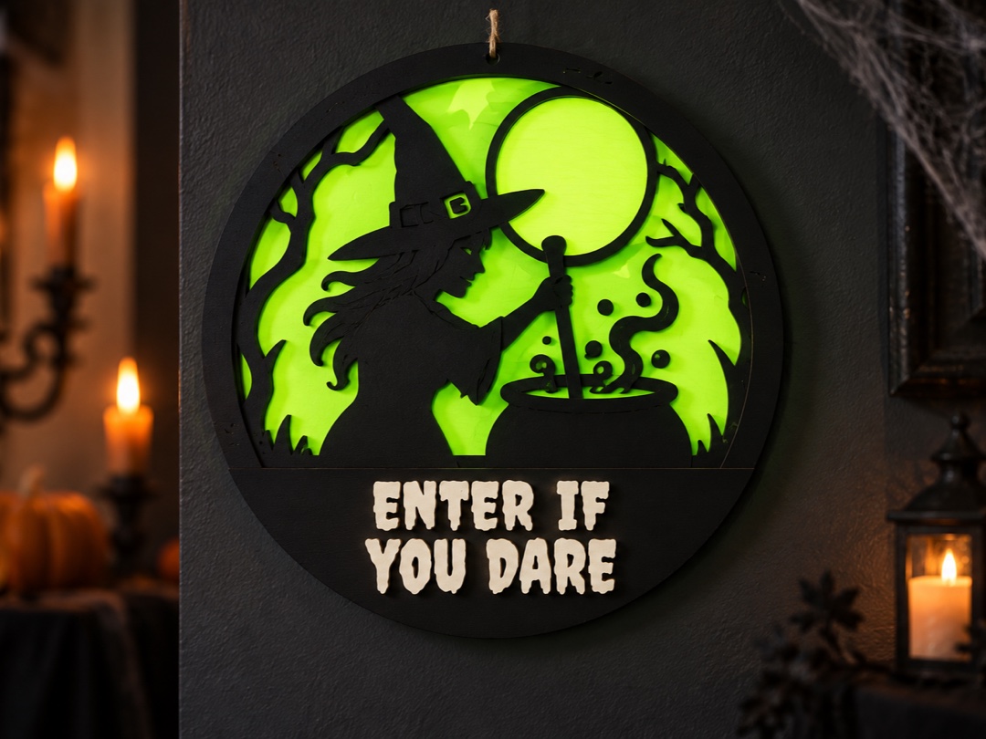 Round layered door sign with a witch and cauldron